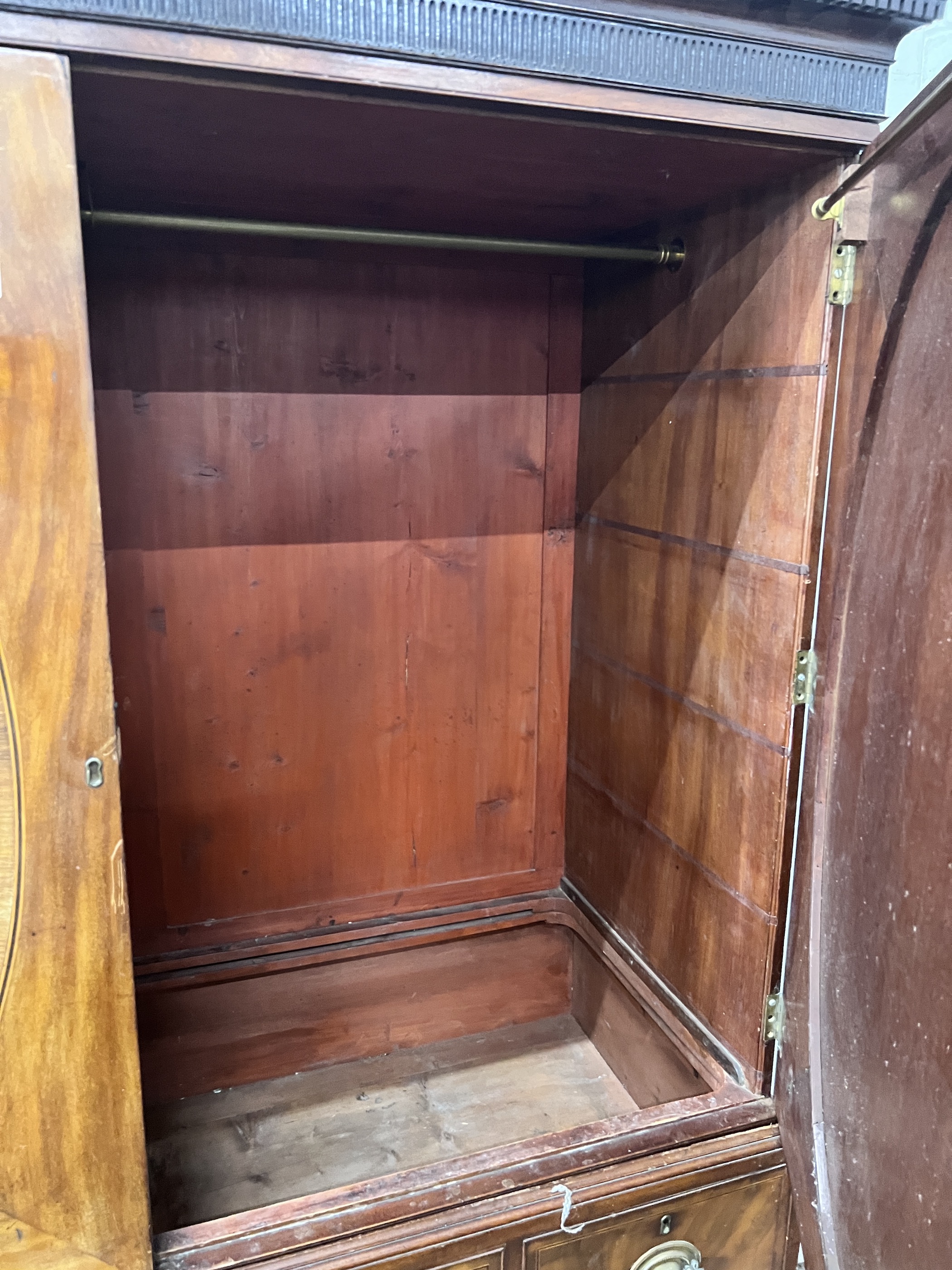 A George III banded mahogany linen press converted to a hanging wardrobe, width 147cm, depth 64cm, height 191cm